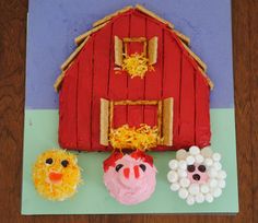 a cake made to look like a barn and farm animals