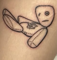 a small tattoo of a teddy bear on the thigh