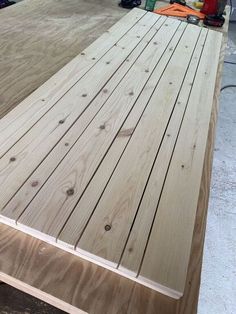 some wood is laying on top of each other in the process of being sanded