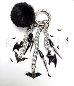 a key chain with bats and spikes attached to it