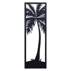 a metal wall hanging with a palm tree