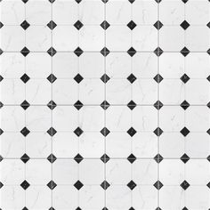 a white and black tiled wall with diamond shapes