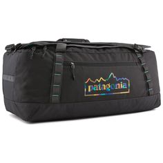 the patagonia duffel bag is black with rainbow mountains on it and blue trimmings