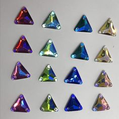 seven different colored diamonds are arranged in a row