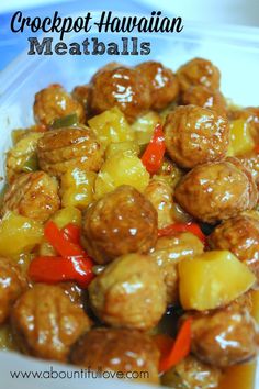 meatballs and pineapples are mixed together in a sauce that is ready to be eaten