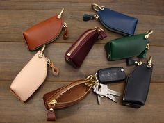 six different color leather key cases with gold zippers