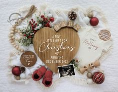 a baby's first christmas ornament surrounded by other holiday decorations and personalized items