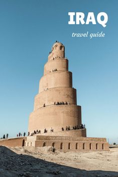 a tall tower sitting on top of a sandy beach next to the words iraq travel guide