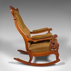 an old rocking chair is shown on a gray background