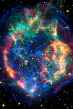 an image of a very large star in the sky with many stars around it and some bright colors