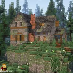 a very nice looking house in the middle of some bushes and trees with lots of windows