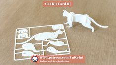 a cat and mouse cut out on a wooden table with text overlay that reads gat kit card 01