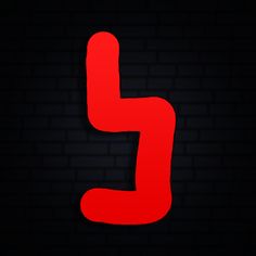 the letter j is made up of red lines on a black brick wall, and it appears to be dark