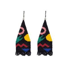 a pair of earrings with multicolored beads and tassels on white background