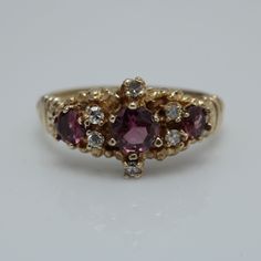 Vintage Diamond Garnet Ring  14k Yellow Gold Size 6 can be sized at a low cost  The Ring is 9.3mm across by 3.6 in Height  Diamond 0.06ct total and Garnet 0.66ct  It comes with a new gift box item # 5825 Vintage Garnet Rings, Pretty Wedding Rings, Rubellite Ring, Antique Gold Rings, Art Deco Sapphire Ring, Seed Pearl Ring, Engagement Ring Diamond Cut, Eyes Open, Victorian Rings