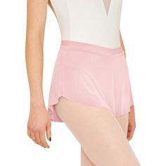 a woman in pink and white leotard posing for the camera with her hands on her hips