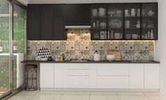 a kitchen with black and white tiles on the backsplash, counter tops and cabinets