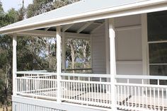 a white house with porch and covered front porch