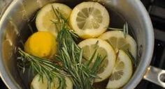 lemons and rosemary are in a pot on the stove