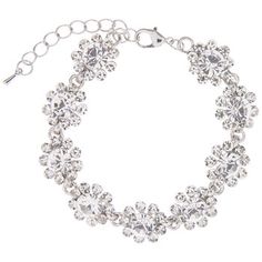 Add some sparkle to your ensemble with this Flower Rhinestone Bracelet. This dazzling bracelet features an array of clear rhinestones arranged into flower shapes. Each flower shape is made up of one large rhinestone at the center that's surrounded by nine smaller ones. Wear it on your wrist or ankle to show off your unique style! Details: 	 Length: 7" 	 Thickness: 9/16" 	 Metal Color: Silver Card contains 1 bracelet. Silver Flower Crystal Bracelet For Party, Silver Flower Crystal Party Bracelet, Silver Card, Flower Shapes, Gilded Age, Home Supplies, Rhinestone Bracelet, Clear Rhinestones, Metal Color