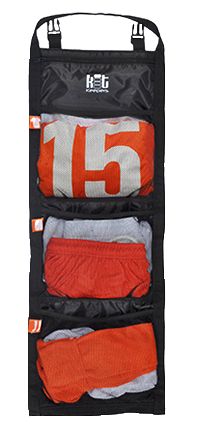 an orange and black hanging organizer with five pairs of socks in it's pockets