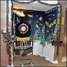 an open door decorated with christmas decorations and signs