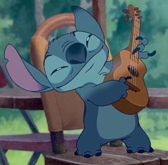 stitch playing the guitar while sitting on a chair in disney's lili and pooh