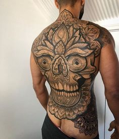 a man with a tattoo on his back