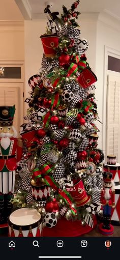 a christmas tree decorated with black and red ornaments