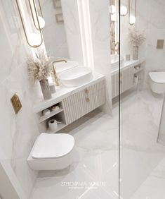 a white bathroom with two sinks and mirrors