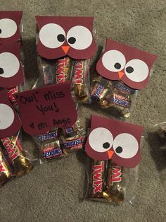 some candy bags with owls on them sitting on the floor next to each other and one has a sign that says, don't miss you