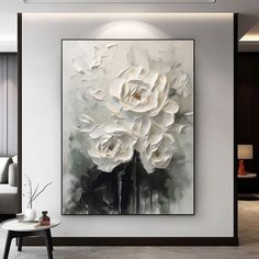 a large white flower painting in a living room