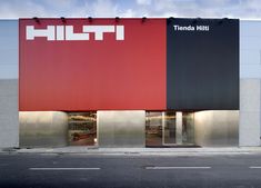 a red and black building with the word hilti on it's side