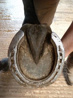 a close up of a person's foot with an object in the middle of it