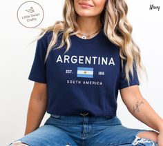 Argentina Shirt, Argentinian Flag T-shirt, Unisex Visit our store for more https://www.etsy.com/shop/LittleSwanCrafts This Bella Canvas unisex jersey short-sleeve tee fits like a well-loved favorite.  Super soft cotton, high-quality fabric, and quality print.  - 100% Airlume combed and ringspun cotton (Only heather colors are 52% cotton, 48% polyester - Athletic Heather is 90%    cotton, 10% polyester) - Light fabric - 4.2 oz/yd² (142 g/m²) - Retail fit - Eco-friendly - Runs true to size - Soft Argentine Traditional Clothes, Argentina Culture Clothes, Vintage Argentina Jersey, Argentina Shirt, Argentinian Flag, Argentina Jersey 2022, Jersey Outfit, Flag Tshirt, Jersey Shorts