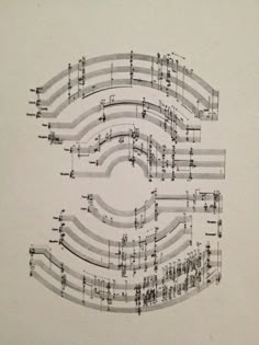 a sheet with musical notes arranged in the shape of an e on top of it