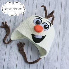 a crocheted hat with an orange nose and antlers attached to the brim