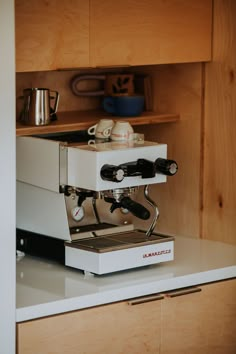 an espresso machine sitting on top of a counter