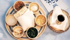 a plate with some food on it next to a cup and saucer filled with liquid