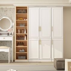 a bedroom with white closets, mirror and vanity in the corner next to it