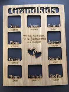 a wooden frame with the names and date for grandkids on it in different languages