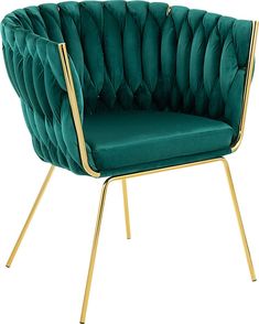 a green velvet chair with gold legs