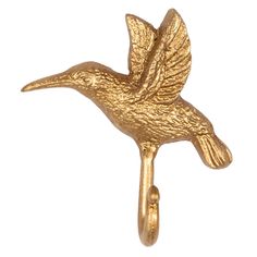 a gold bird brooch pin on a white background