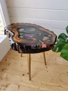 a wooden table with flowers painted on it