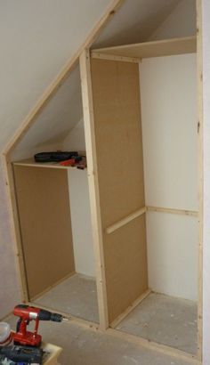 an unfinished closet is being built in the corner of a room with tools on it