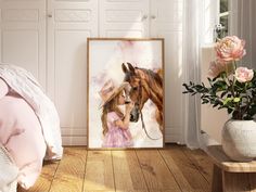 a painting of a girl and a horse on the wall next to a bed with pink sheets