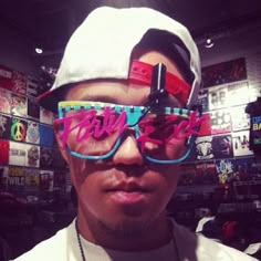 a man wearing sunglasses and a hat in a store