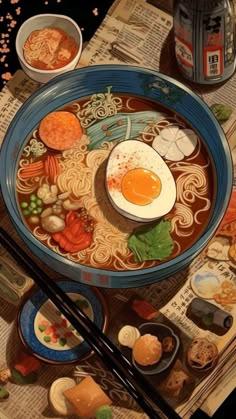 a bowl of ramen with chopsticks next to it on top of a newspaper