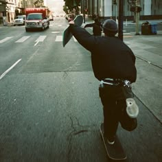 a man riding a skateboard down the middle of a street