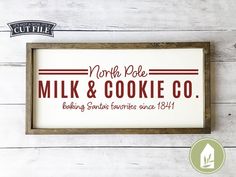 a sign that reads north pole milk and cookie co on it's side, with the